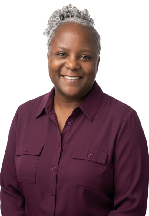 Nedra Sink, owner of Autumn Endeavors, smiling in a burgundy blouse